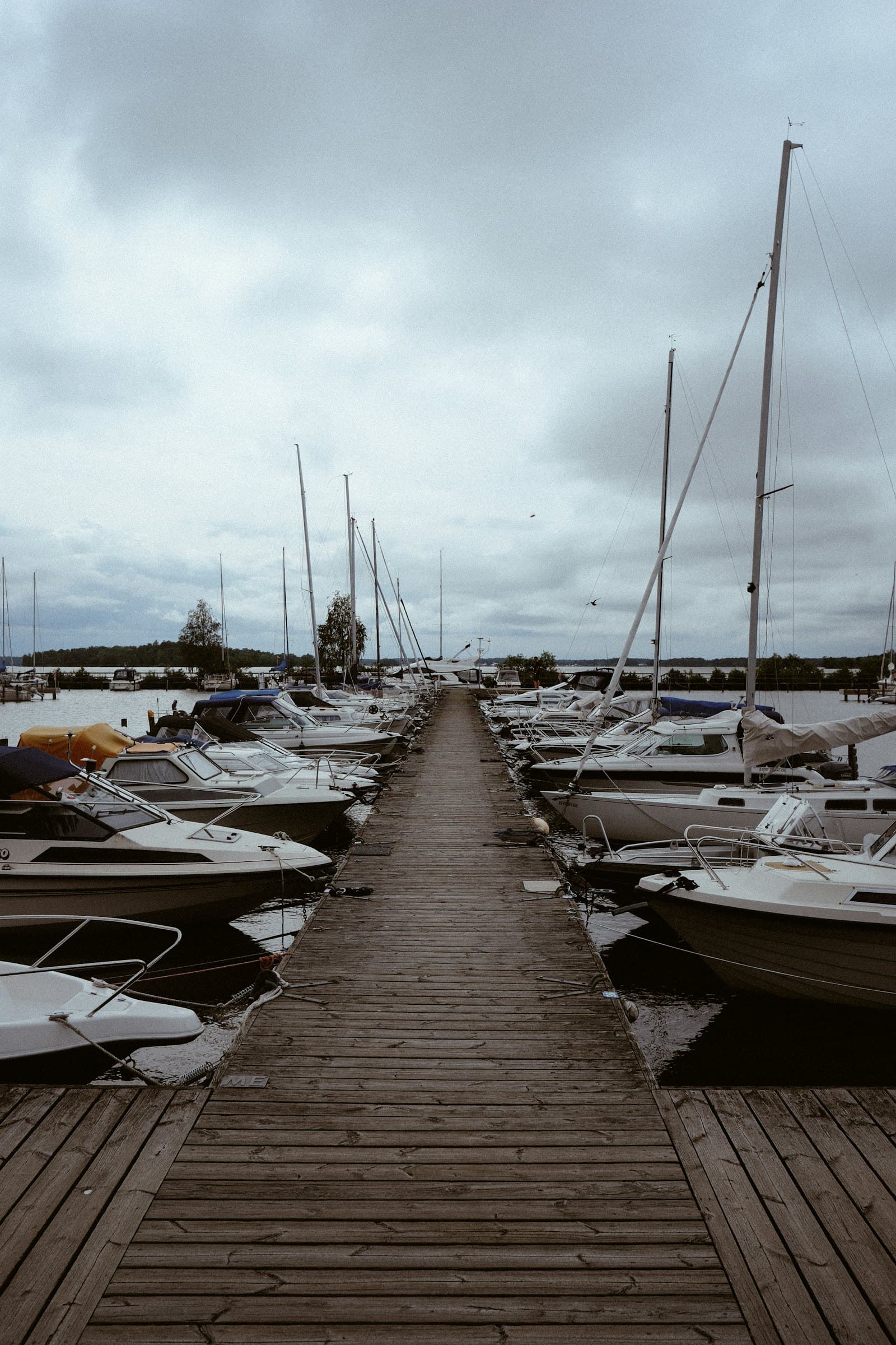 Boats along a wooden pier in the Västerås harbour on Lake Mälaren